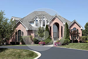 Luxury brick home with cedar roof