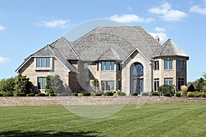 Luxury brick home with cedar roof