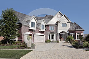 Luxury brick home with stone pillars