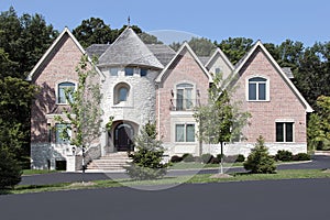 Luxury brick home with turret