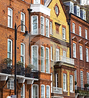 Luxury brick house with white windows in quiet area in central London. Apartments on the banks of the Thames