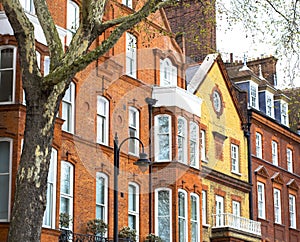 Luxury brick house with white windows in quiet area in central London. Apartments on the banks of the Thames