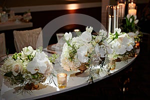 Luxury bridal table setting at a wedding venue photo