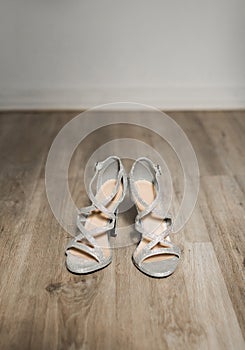 Luxury bride silver shoes on her wedding day