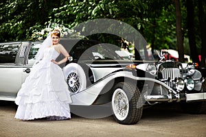 Luxury bride in wedding dress about limousine