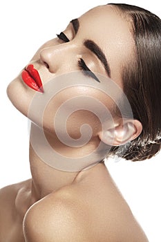 Luxury brunette woman with red lips make-up, eyeliner, clean skin
