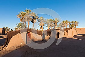 Luxury camp with tent in the desert among sandy dunes. Beautifil sunny day in the Sahara, Morocco