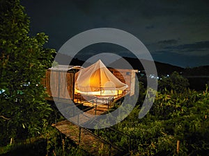 The luxury camp tent at night on top of the mountain in Chiang Mai, Thailand. photo