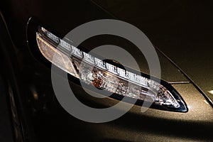 Luxury car headlight detail close-up