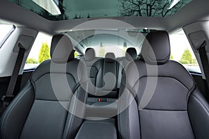 Luxury car leather seats. Interior of new modern clean expensive car. Passenger seats with leather. Closeup details. New