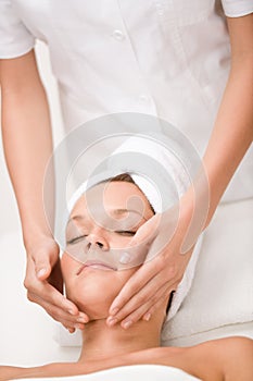 Luxury care - woman at face massage