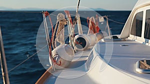 Luxury catamaran sailing race through deep blue Aegean sea