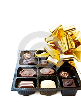 Luxury chocolates and festive golden ribbons