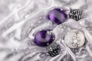 Luxury Christmas balls Silver pine cones on white satin Christmas decoration combined purple and silver colors.