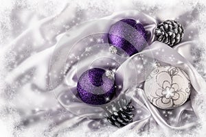 Luxury Christmas balls Silver pine cones on white satin Christmas decoration combined purple and silver colors.