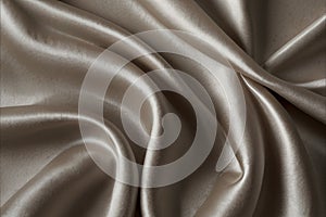 luxury cloth with drapery and wavy folds of ivory color creased smooth silk satin material texture. Abstract