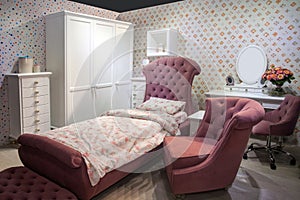 Luxury comfortable modern bedroom interior for girl in pink and white colors