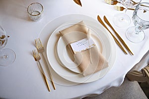 Luxury cozy autumn wedding table decoration in the restaurant. Fresh and dried flowers, roses, carnations. Beautiful table setting