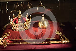 Luxury crown jewelry on red satin