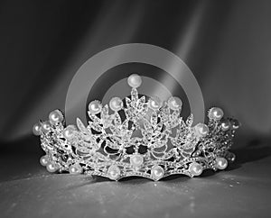 Luxury crown with pearls and jems and diamonds. Black and white photo,