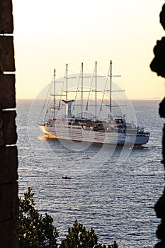 Luxury cruise ocean liner ship sailing from port on sunrise, sunset, Italy Sorrento bay, travel tour, work on the ship, vacancies