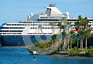Luxury cruise ship cruising by island