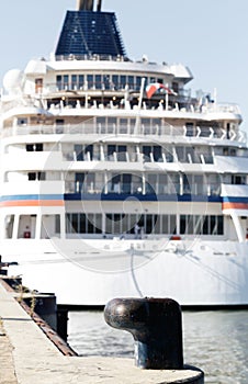 Luxury cruise ship docked in port. Front view of passenger vessel. Selective focus. Vintage Color Grading