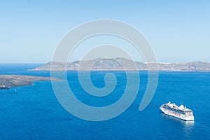 Luxury cruise ships, caldera and volcano near Fira, capital of the Greek Aegean island, Santorini, Greece. Panorama