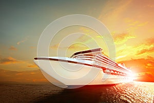 Luxury cruising ship over sea with sunset sky background