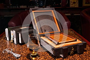 Luxury Cuban cigars in a box and alcohol photo