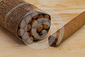 Luxury Cuban cigars on the wooden desk