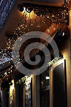 Luxury decorated store front with garland lights in european cit