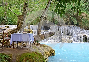 Luxury Dining in nature with turquoise blue waterfall for special occasion, Kuang Si Tat Kuang Xi Falls nearby Luang Prabang, Laos