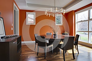 Luxury Dining Room with Orange Walls