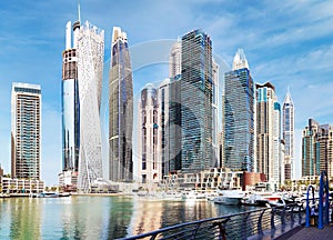 Luxury Dubai Marina canal and promenade in beautiful summer day,Dubai,United Arab Emirates photo