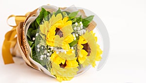 Luxury elegance beautiful bouquet made of fresh bright yellow sunflowers and green leaves