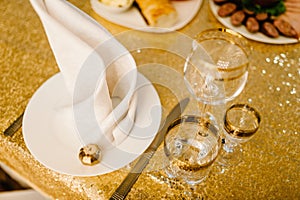 Luxury elegant table setting dinner in a restaurant. Selective focus on glasses. Banquet table in the restaurant, the preparation