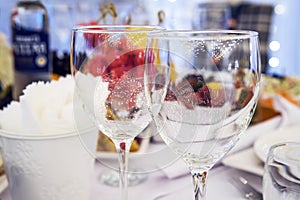 Luxury elegant table setting dinner in a restaurant. Stemwares on a festive beautifully decorated wedding table. Polished wine gla