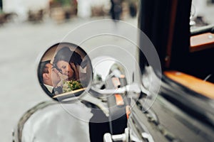 Luxury elegant wedding couple kissing and embracing in stylish b