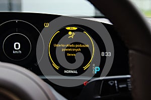 Luxury Elektric Car Dashboard With Airbag Warning Light. Car In Car Repair Shop on Computer Diagnostic photo