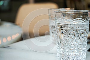 Luxury emtry glass on the marble dinner table