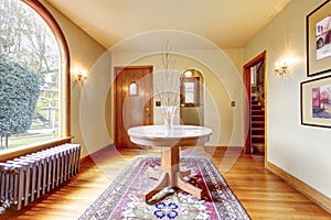 Luxury entrance home interior with round table.