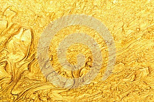 Luxury expensive golden glitter and acrylic inks marble background.