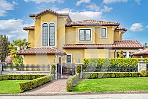 Luxury family house on cloudy sky background