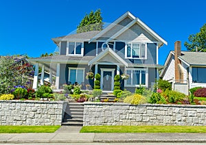 Luxury family house with landscaped front yard on land terrace