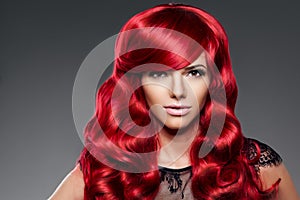 Luxury fashion trendy young woman with red curled hair. Girl w