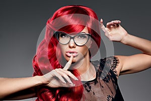 Luxury fashion trendy young woman with red curled hair in glas