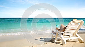 Luxury female sunbathing on the beach