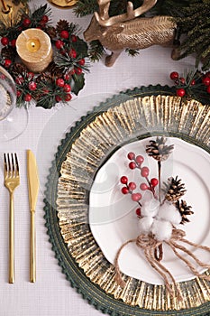 Luxury festive place setting with beautiful decor for Christmas dinner on white table, flat lay