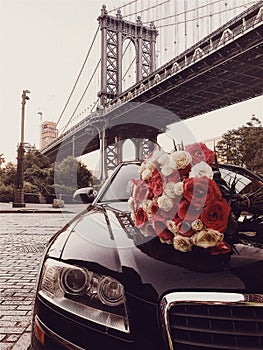 Luxury flower bouquet and limousine car service for romantic date in the city